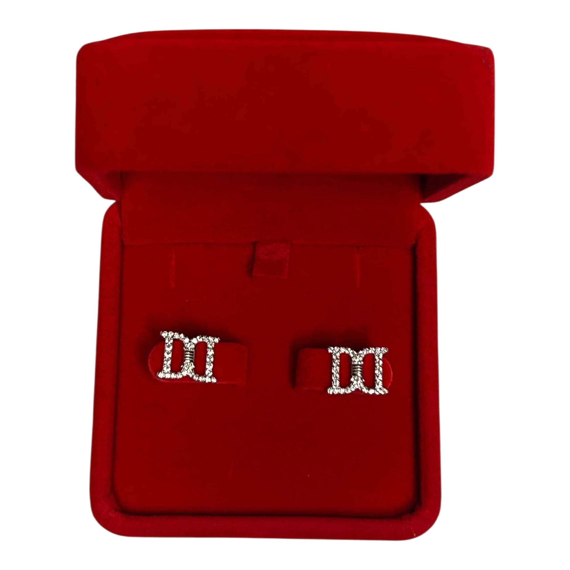 Red jewelry box with a pair of earrings inside